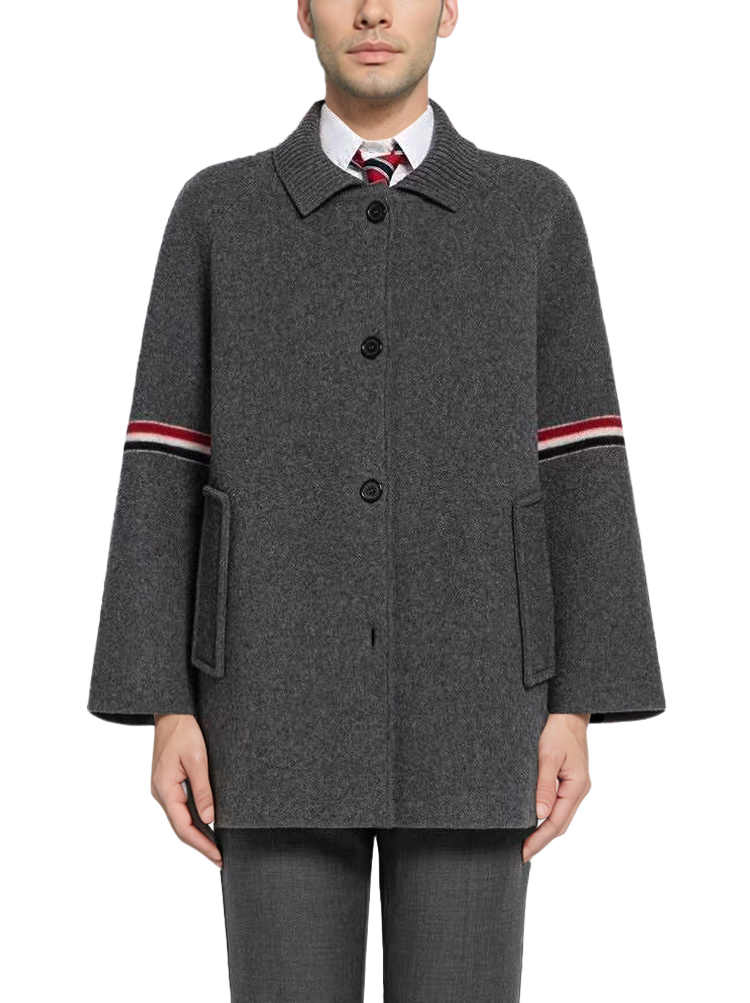 Unisex wool coat with webbing sleeves by Thom Browne, outerwear detail view