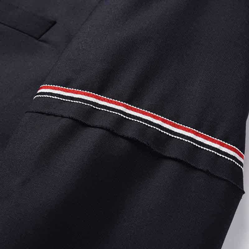 Men's suit jacket by Thom Browne, outerwear detail view