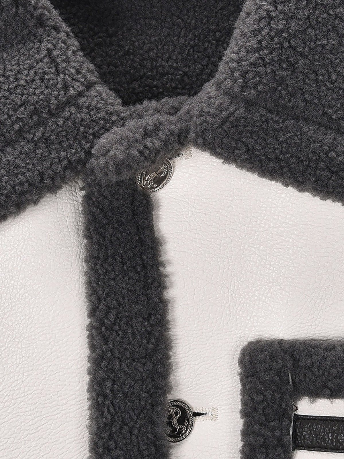 Lapel wool coat by Thom Browne, outerwear detail view