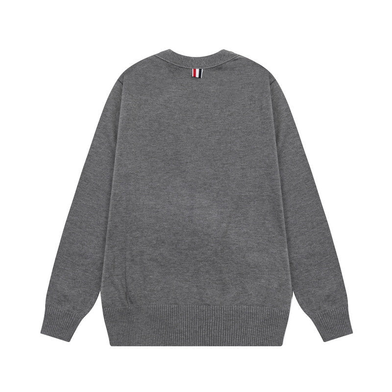 Men's cardigan by Thom Browne, knitwear detail view