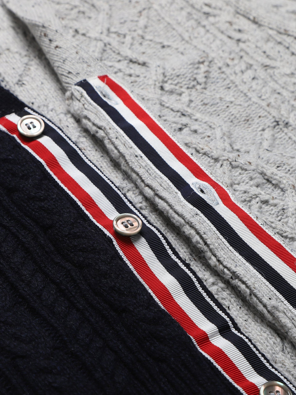 Cable knit cardigan by Thom Browne, knitwear detail view