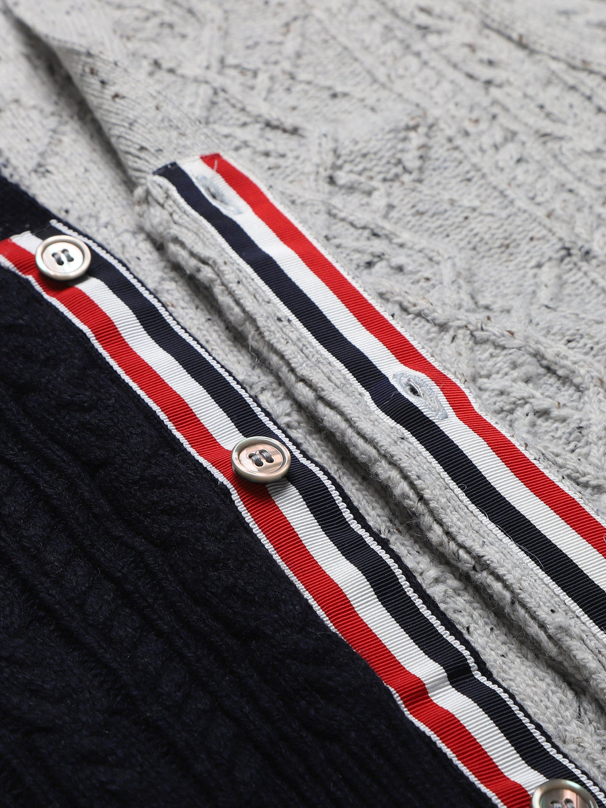Cable knit cardigan by Thom Browne, knitwear detail view