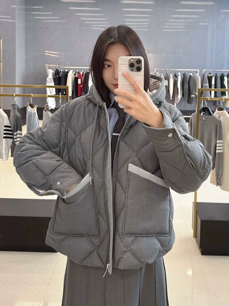 Women's coat by Thom Browne, outerwear detail view