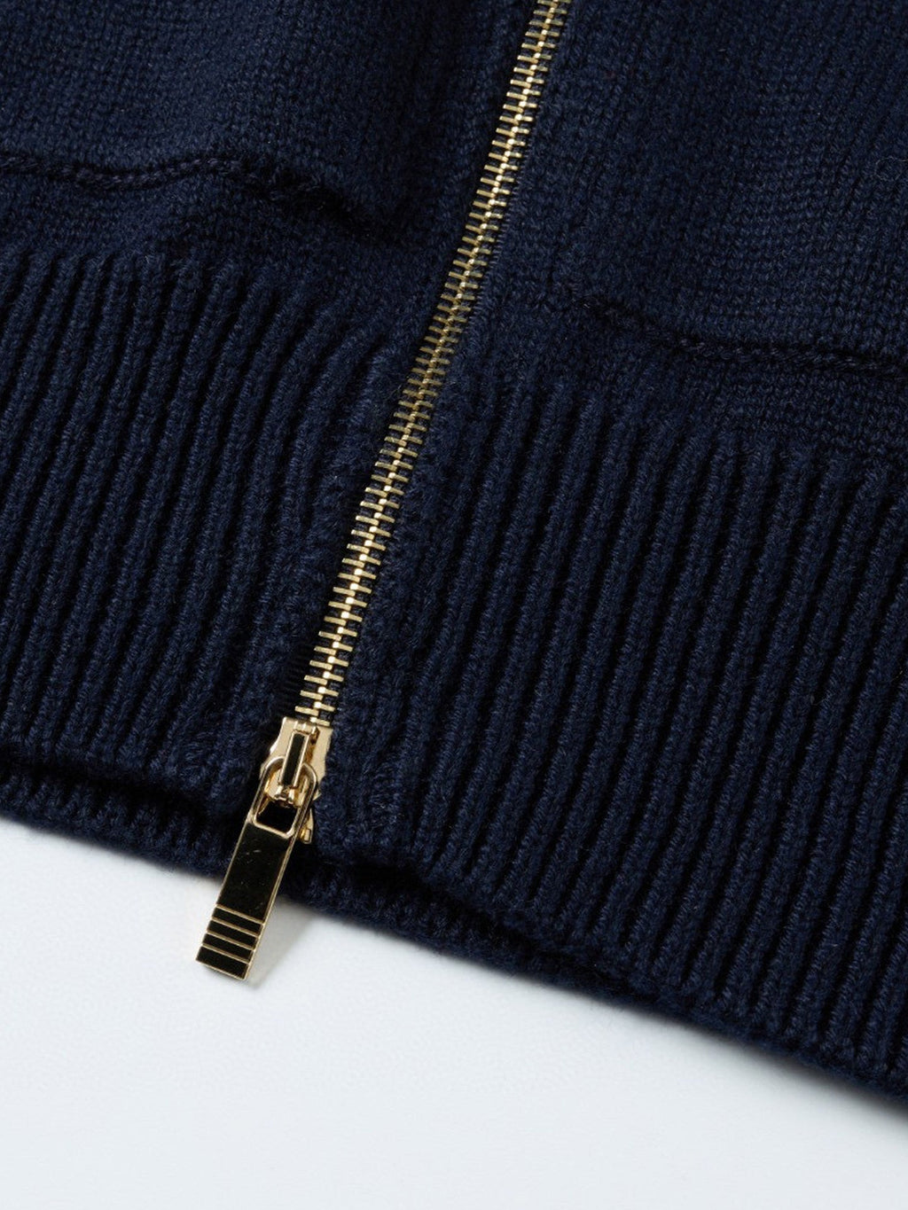 Unisex cardigan by Thom Browne, outerwear detail view