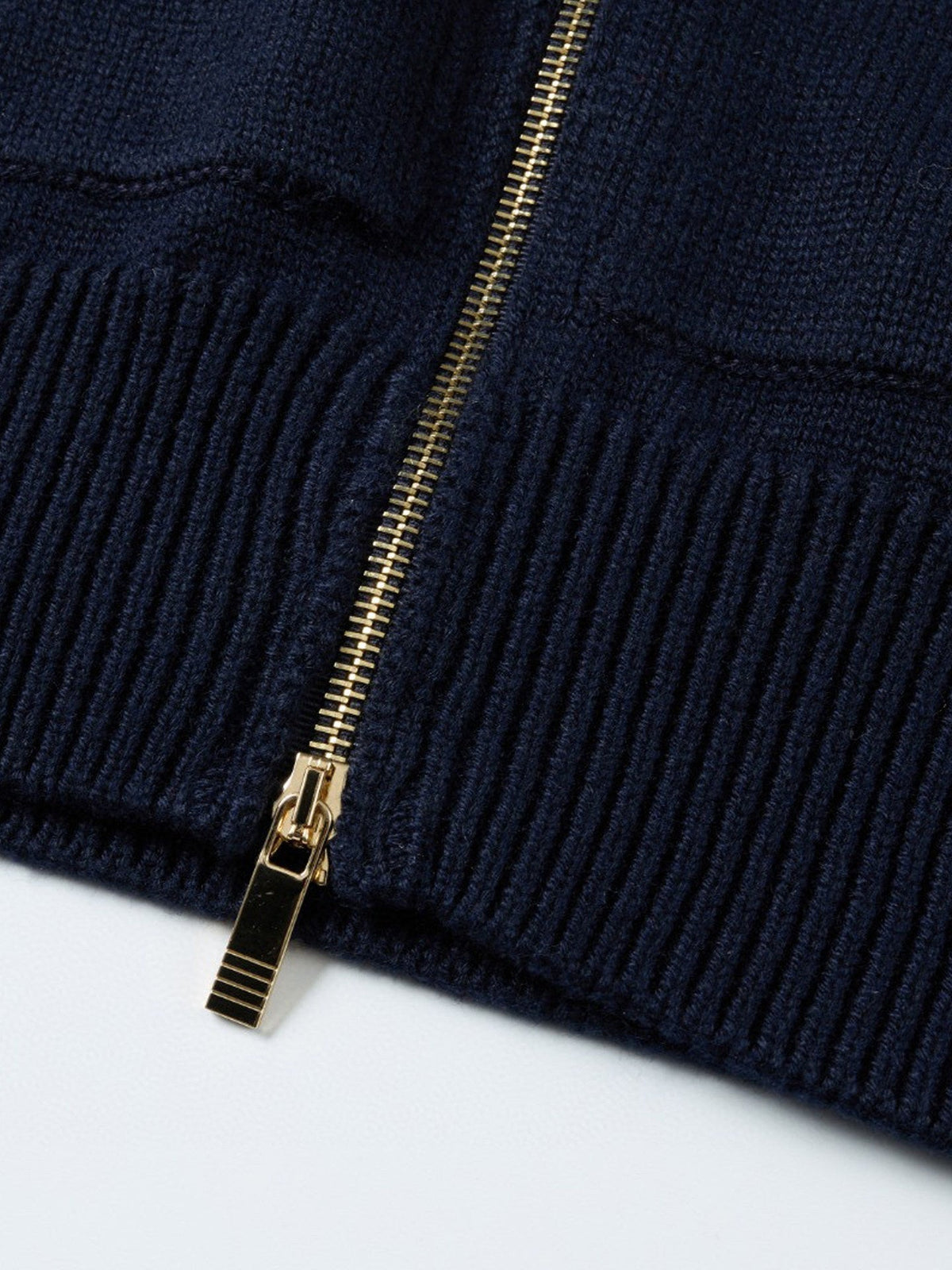 Unisex cardigan by Thom Browne, outerwear detail view