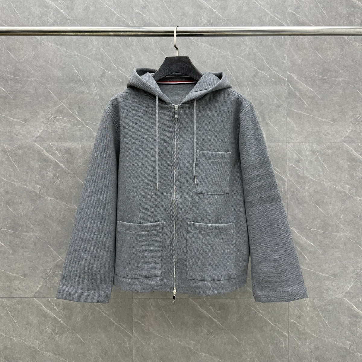 Hooded jacket by Thom Browne, outerwear detail view