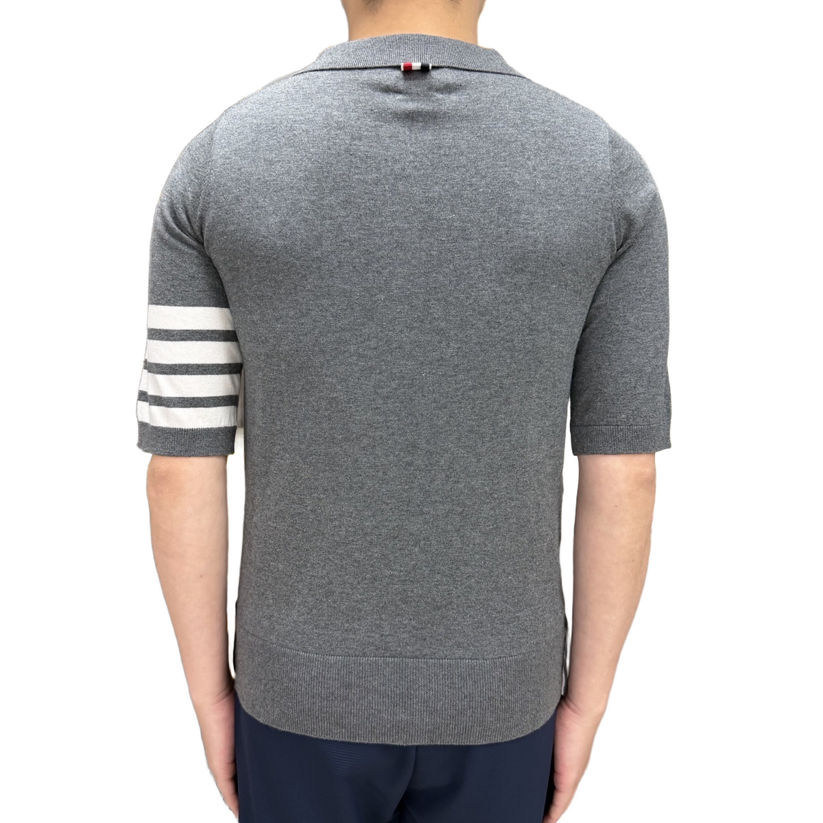 Tennis Racket Jacquard Polo Shirt by Thom Browne, product detail view