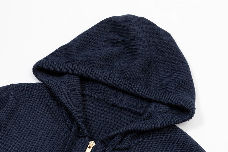 Back puppy hoodie by Thom Browne, outerwear detail view
