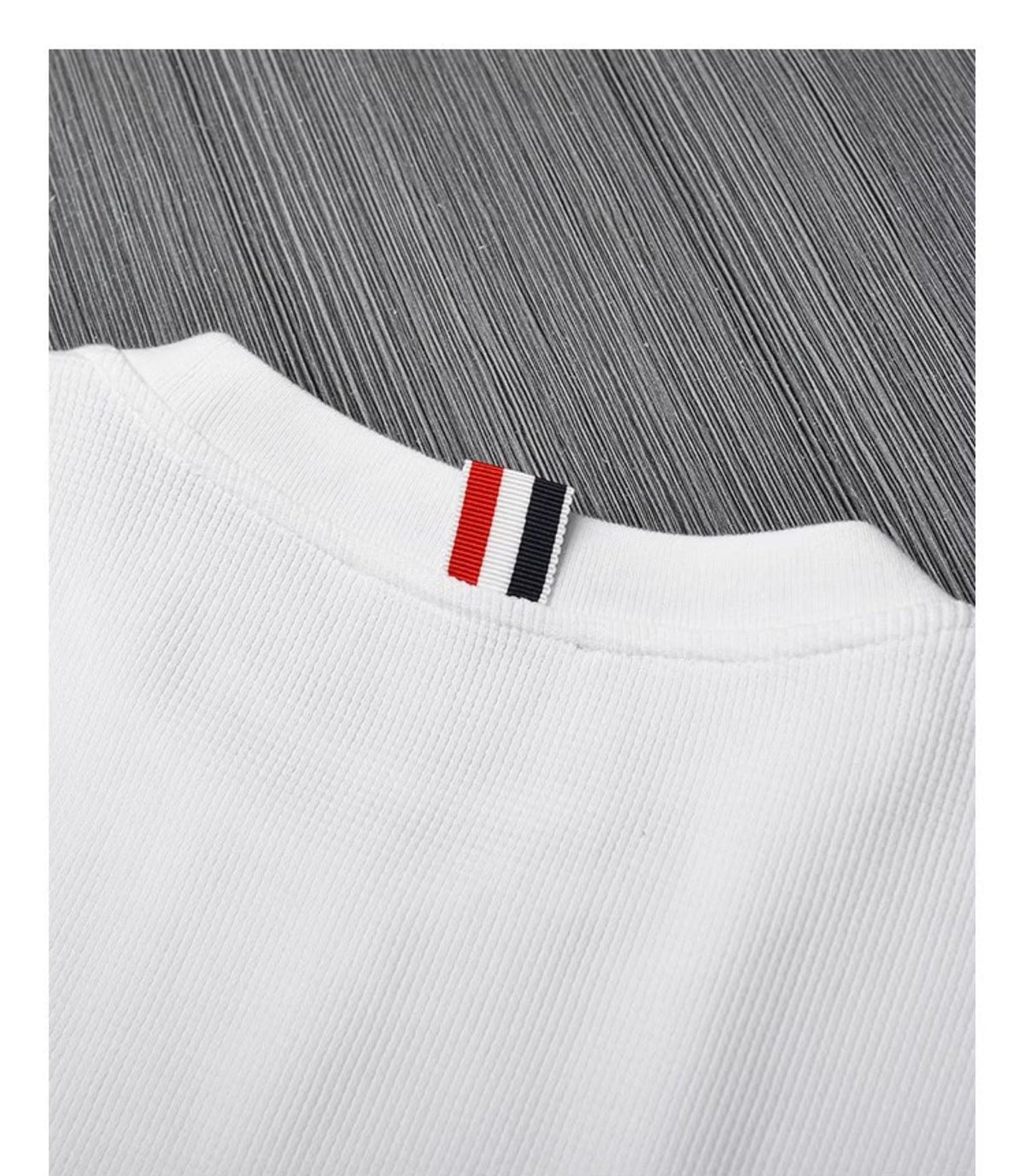 Unisex pullover sweatshirt by Thom Browne, garment detail view