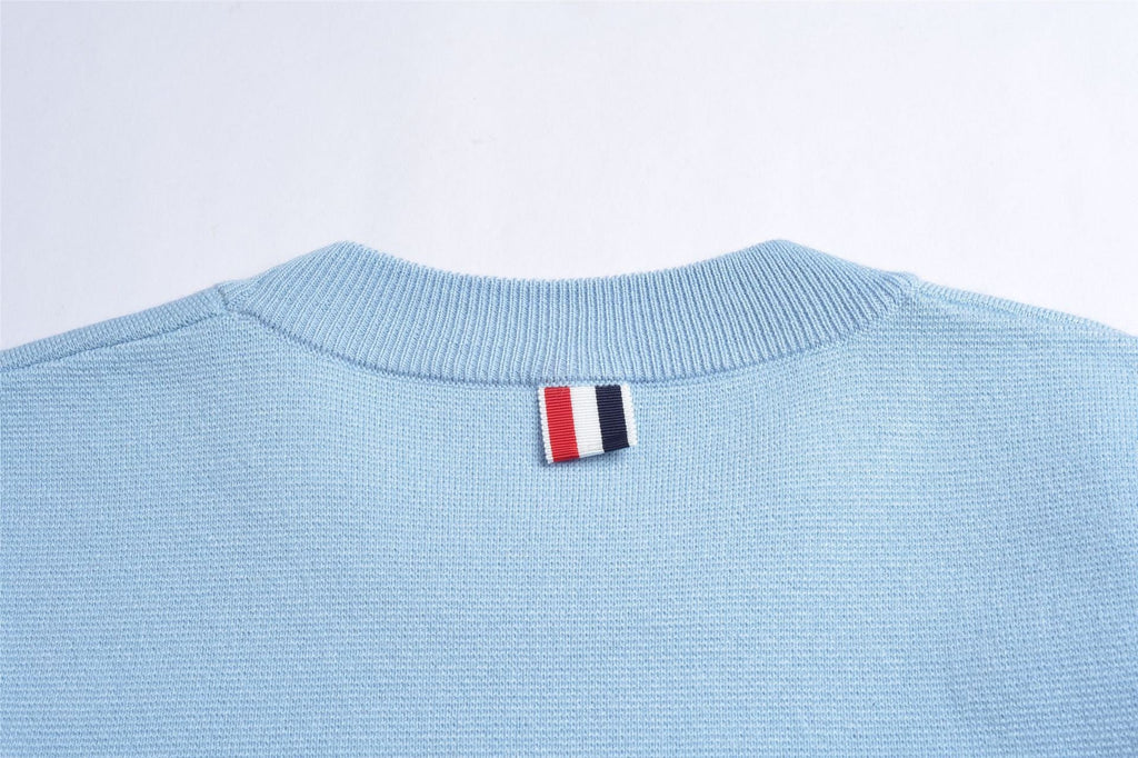 Unisex sweater by Thom Browne, knitwear detail view