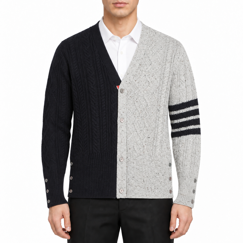Cable knit cardigan by Thom Browne, modeled on a pure white background