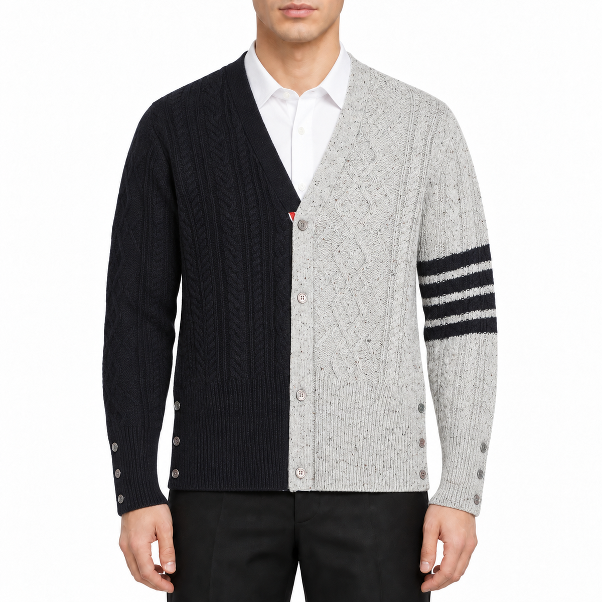 Cable knit cardigan by Thom Browne, modeled on a pure white background