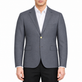 Casual suit by Thom Browne, modeled on a pure white background