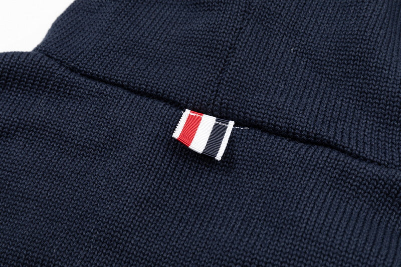 Back puppy hoodie by Thom Browne, outerwear detail view