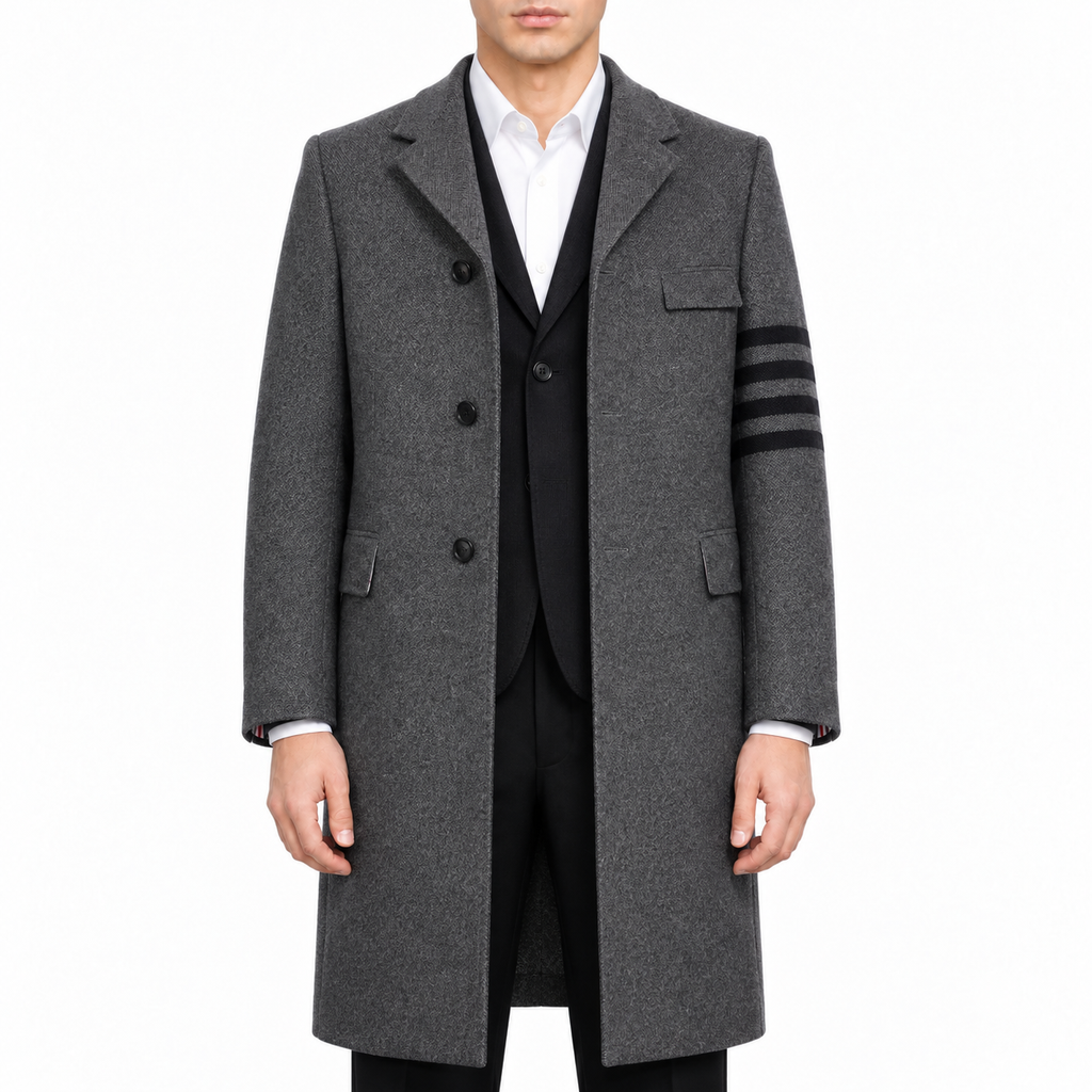 Unisex long wool coat by Thom Browne, modeled on a pure white background