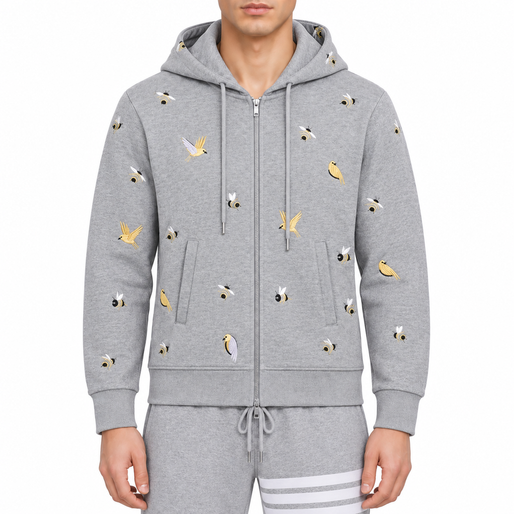 Premium 100% Cotton Embroidered Hoodie - Artistic Zip - Up Hooded Sweatshirt by Thom Browne, modeled on a pure white backgrou