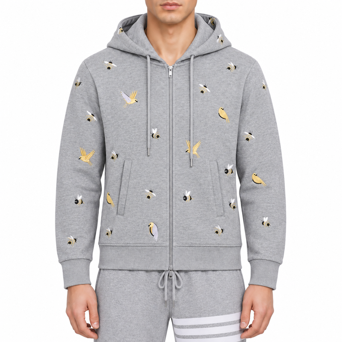 Premium 100% Cotton Embroidered Hoodie - Artistic Zip - Up Hooded Sweatshirt by Thom Browne, modeled on a pure white backgrou