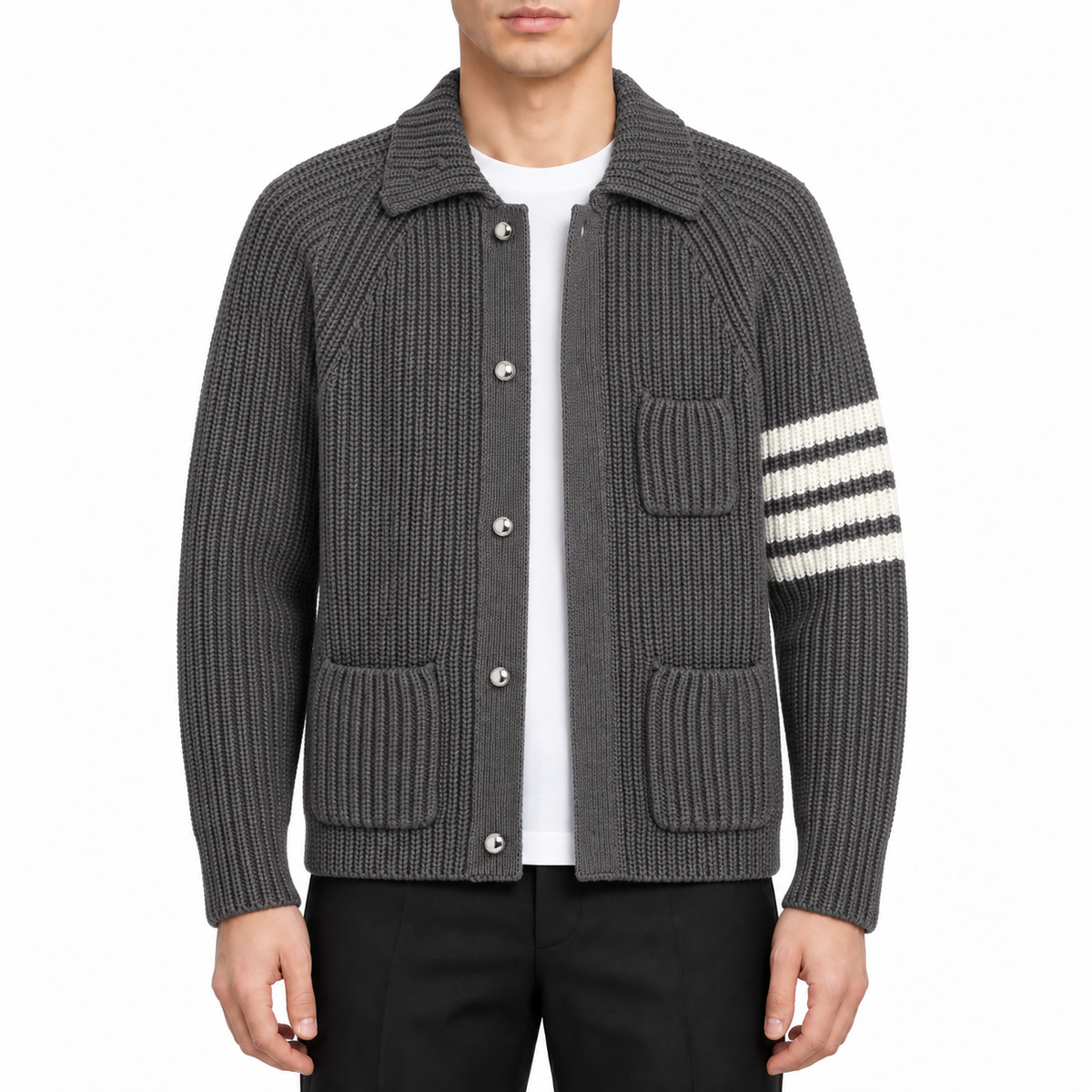Chunky knit cardigan by Thom Browne, modeled on a pure white background