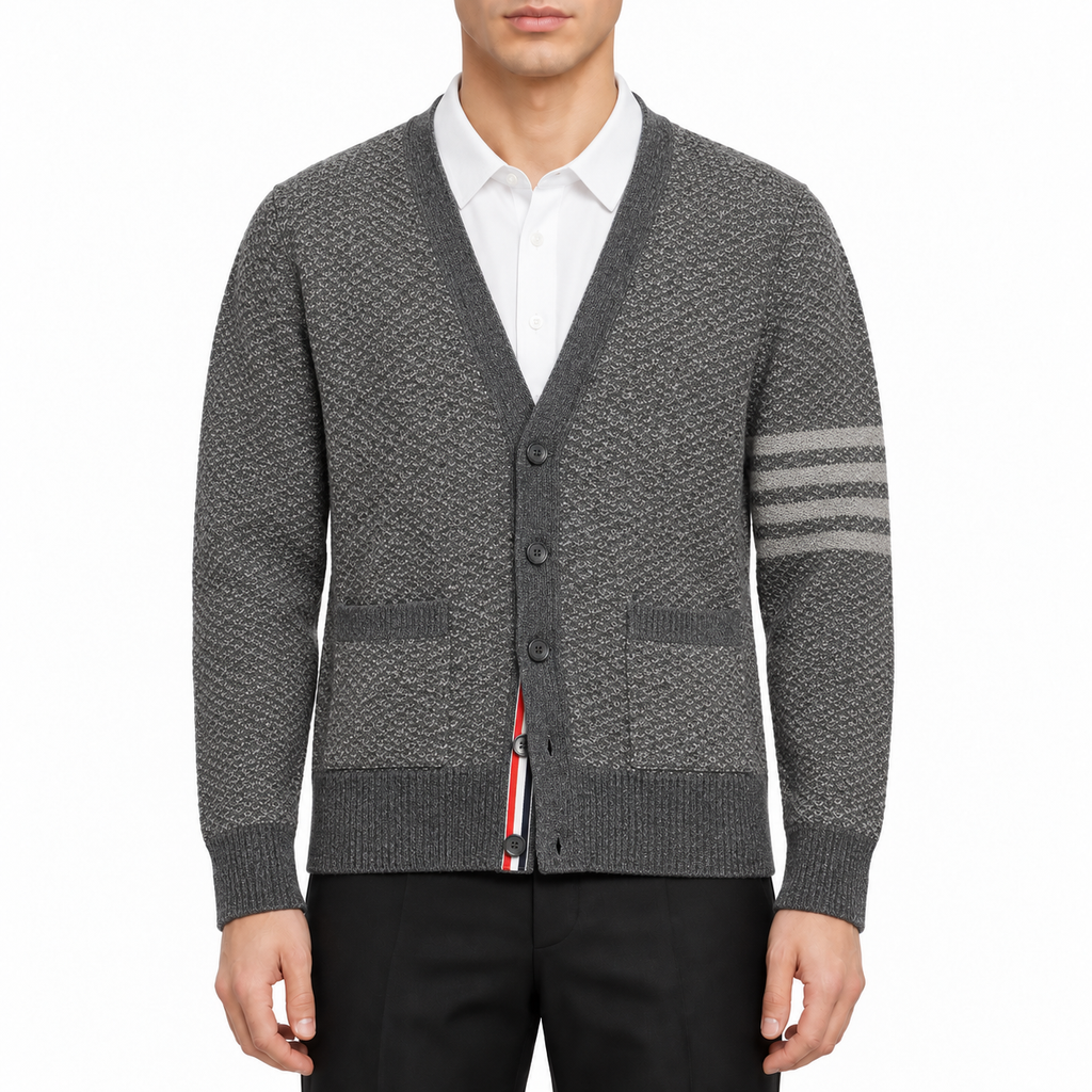Cardigan by Thom Browne, modeled on a pure white background