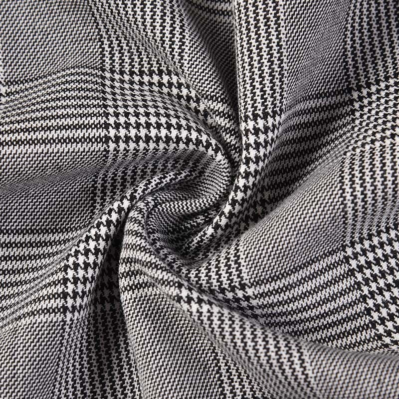 Plaid suit by Thom Browne, outerwear detail view
