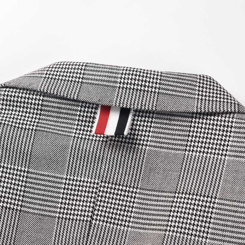 Plaid suit by Thom Browne, outerwear detail view