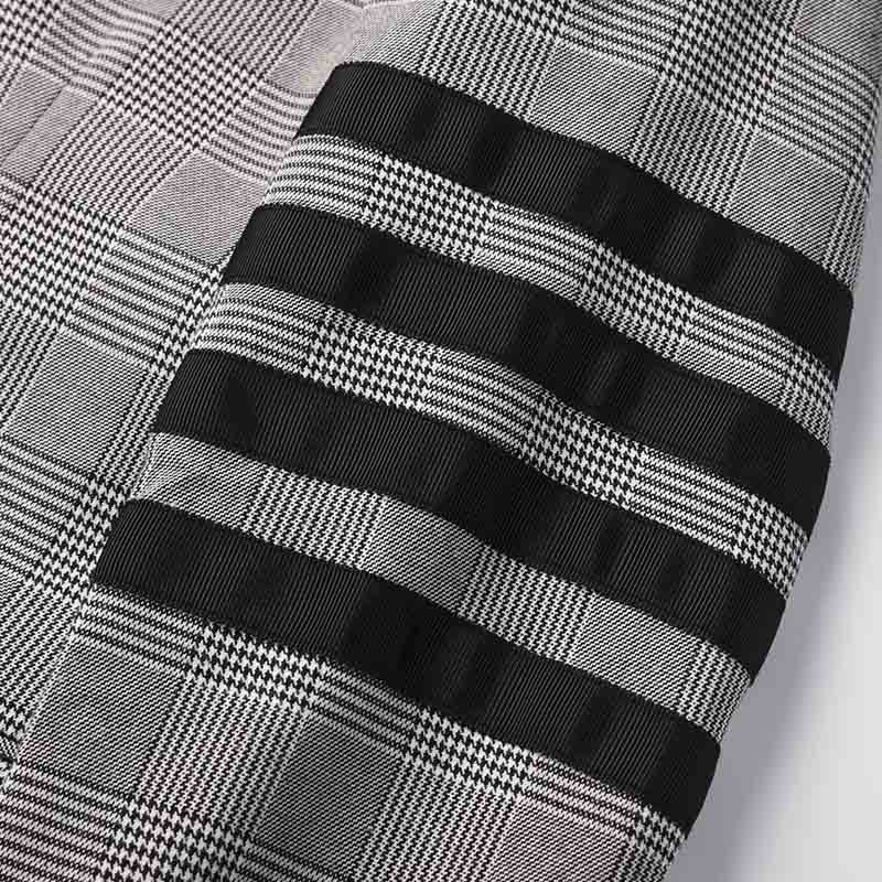 Plaid suit by Thom Browne, outerwear detail view