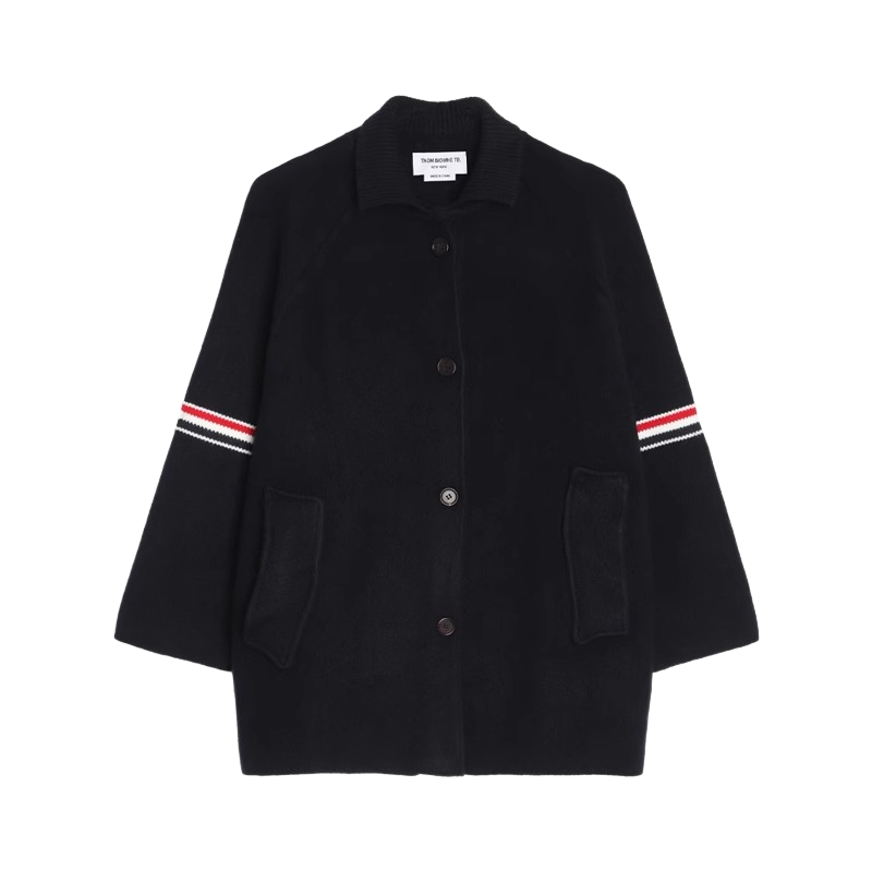 Unisex wool coat with webbing sleeves by Thom Browne, outerwear detail view