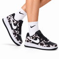 Nike Air Force 1 Low Black White Cow Print Unisex Sneakers Style 05 main angled pair with shoebox
