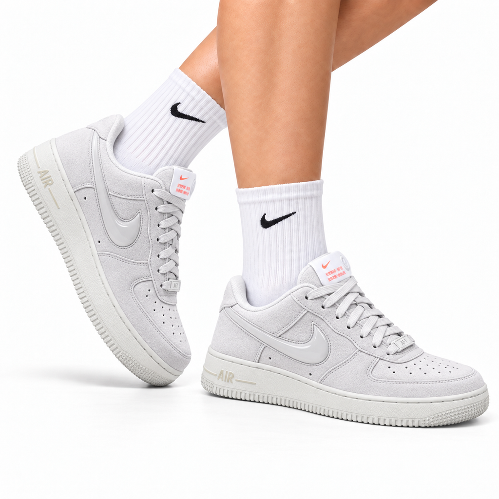 Nike Air Force 1 Low Triple White Unisex Sneakers Style 10 main angled pair with shoebox