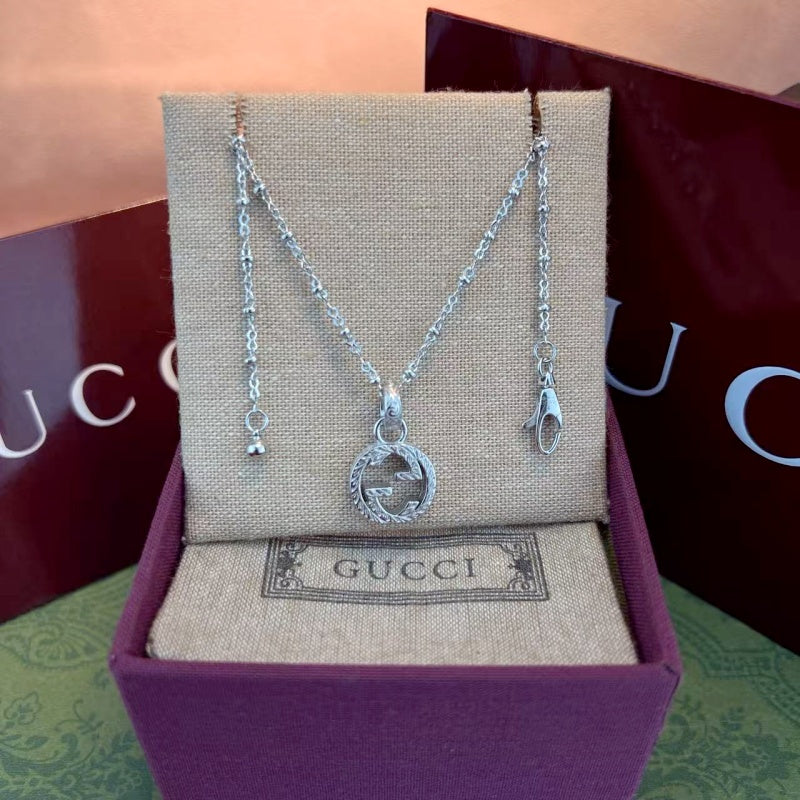 Gucci Patterned Figure 8 Necklace detail view 6
