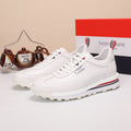 Thom Browne Men’s Triple White Leather Runner Sneakers – left-facing main product view