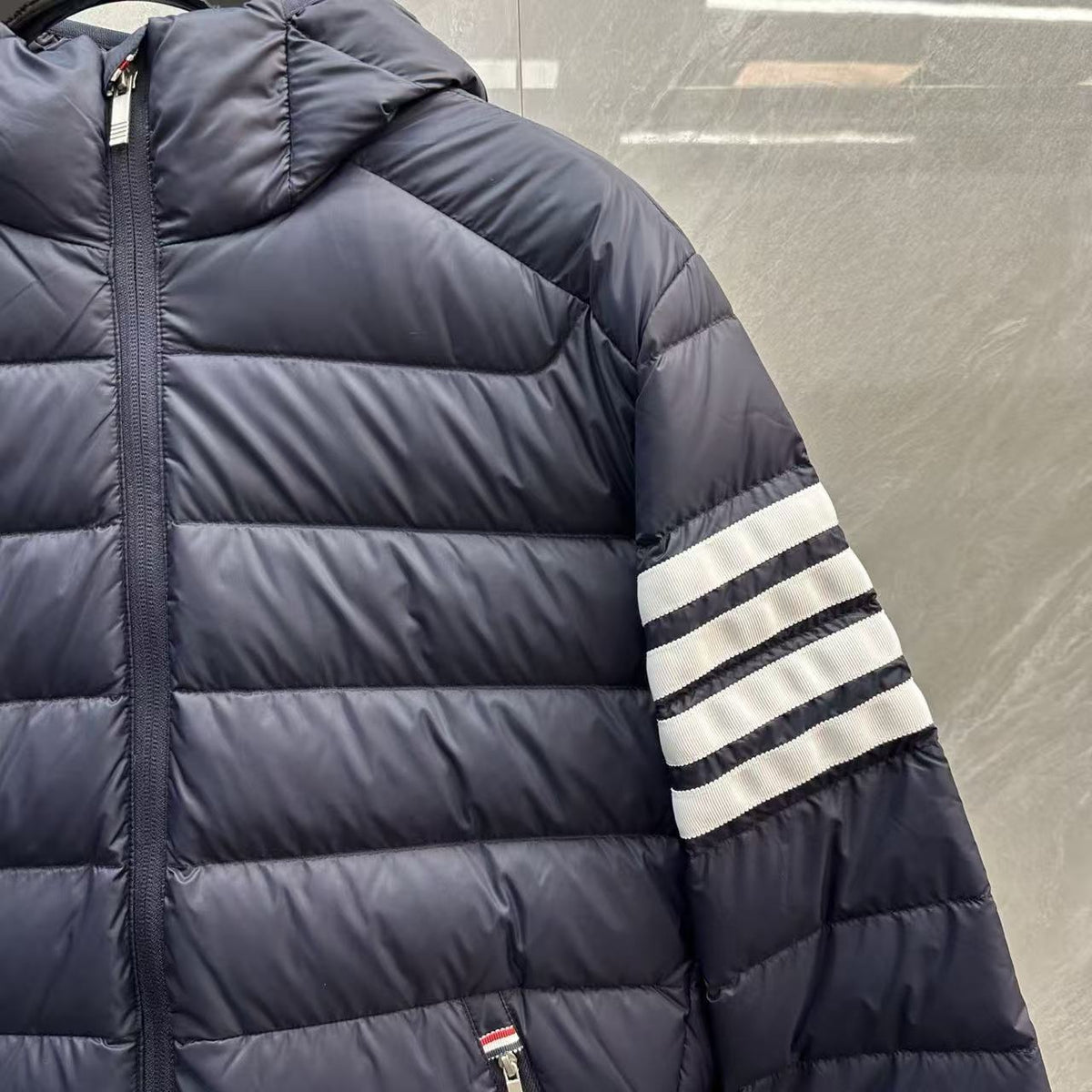 Thom Browne Panelled Four-Stripe Hooded Down Jacket detail view 8