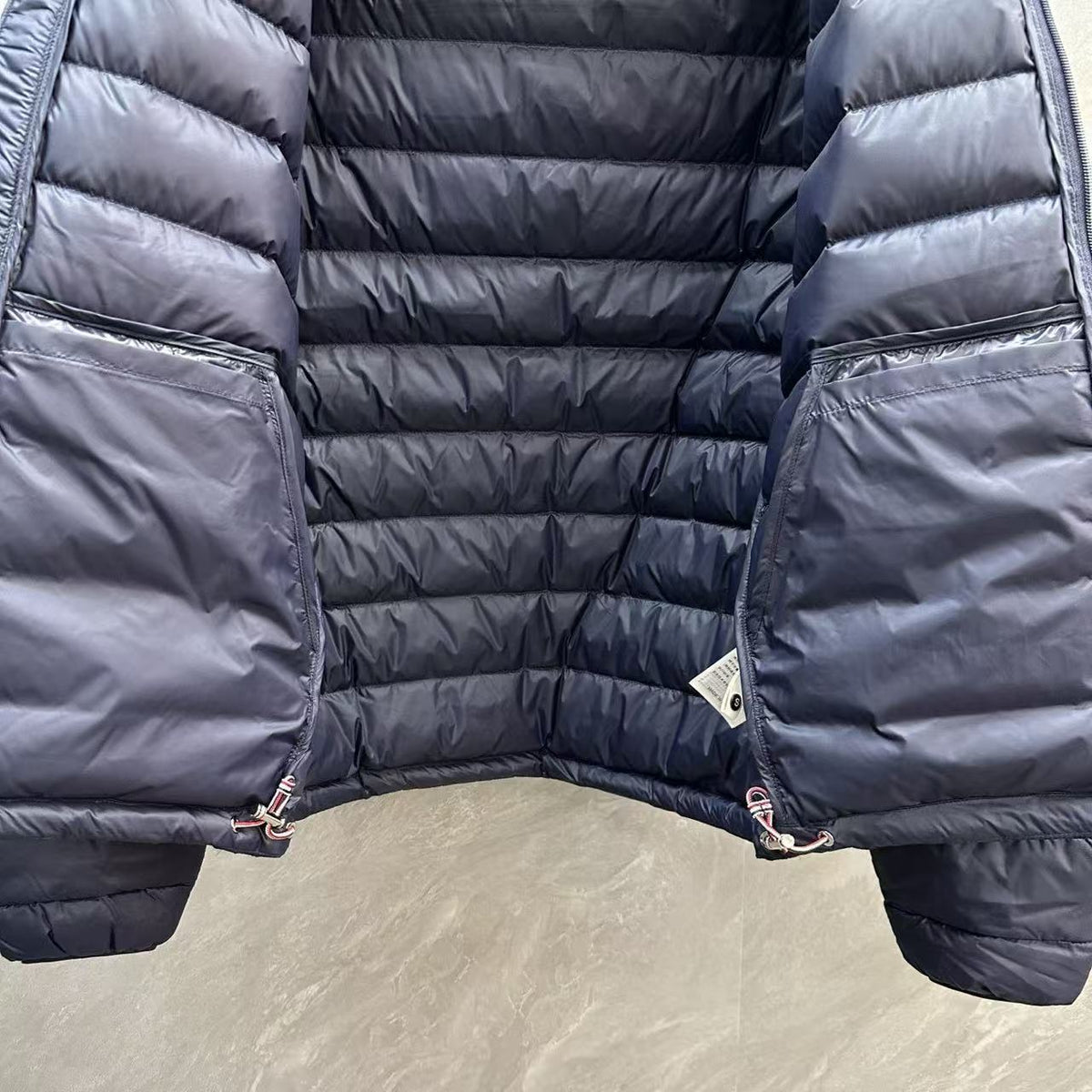 Thom Browne Panelled Four-Stripe Hooded Down Jacket detail view 10